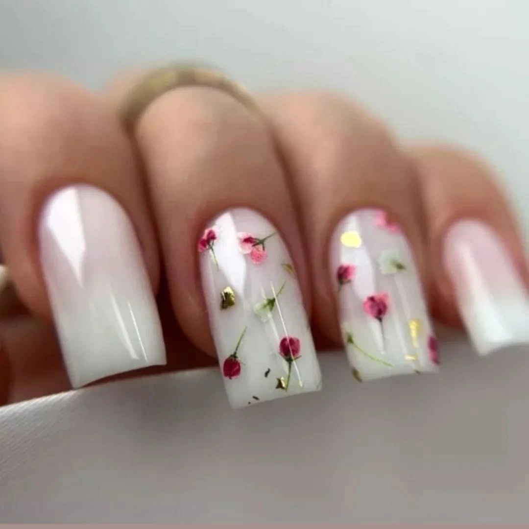 Medium square nails alternating white panels and small red yellow and green details