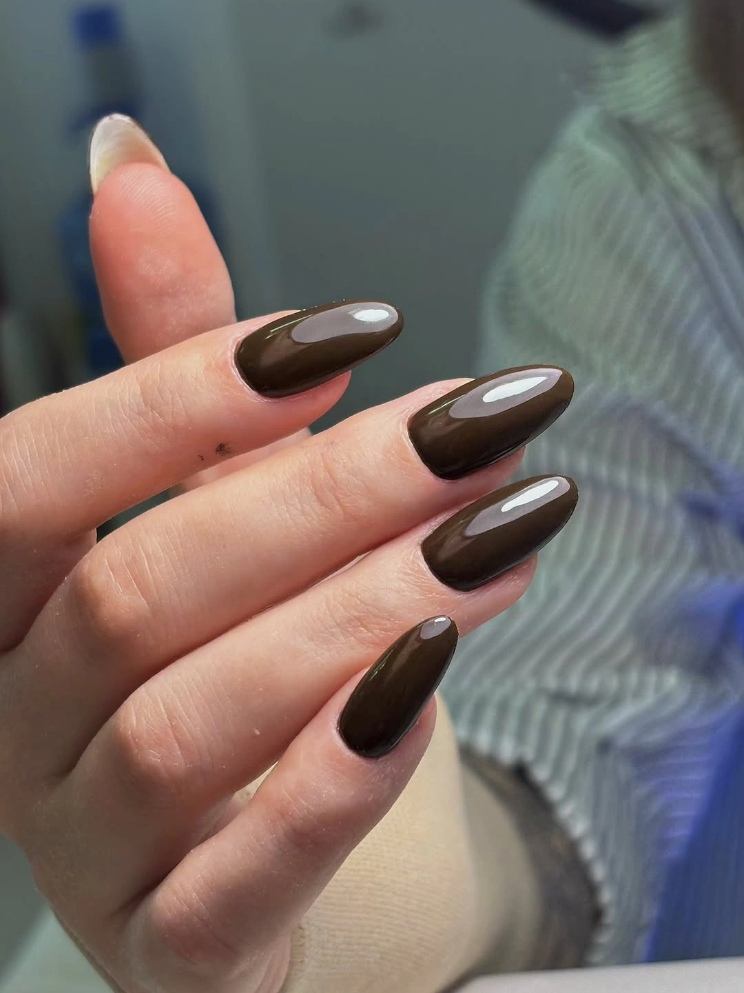 Medium almond nails in chocolate brown with lighter brown accents