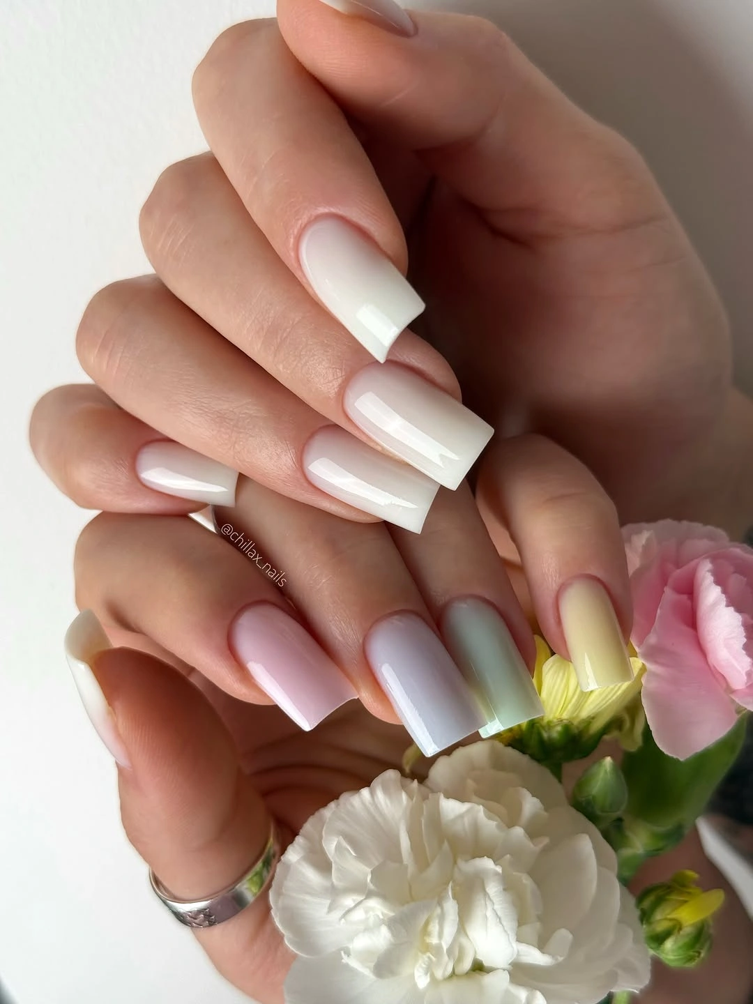 Medium coffin nails with a soft milky pink to white gradient