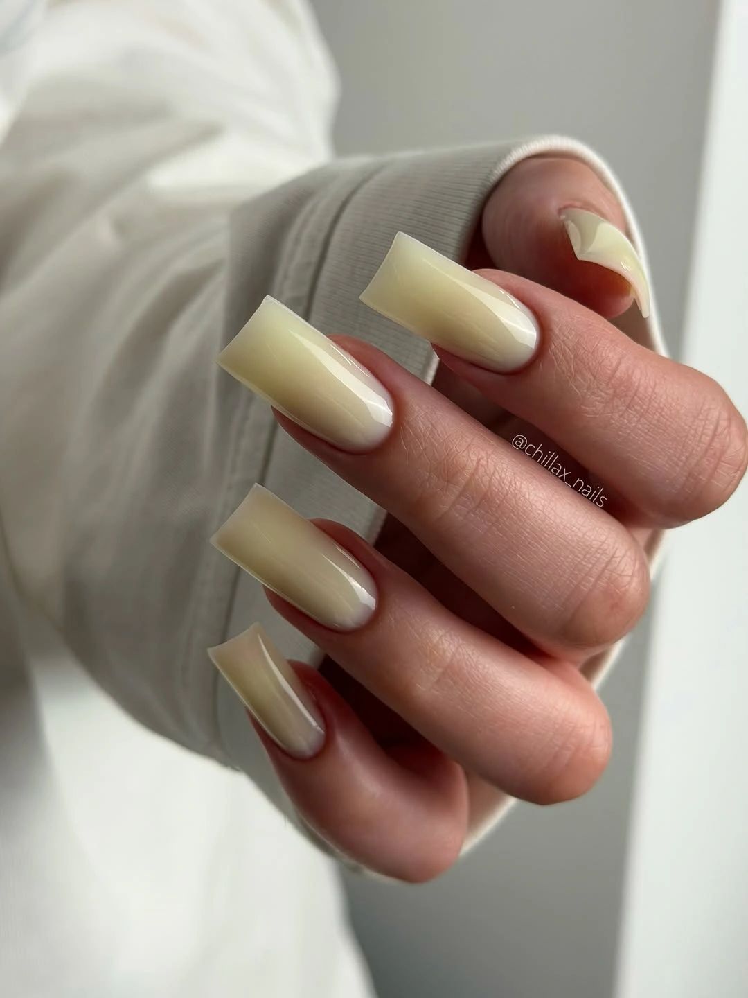 Long creamy ivory coffin nails with a clean uniform finish