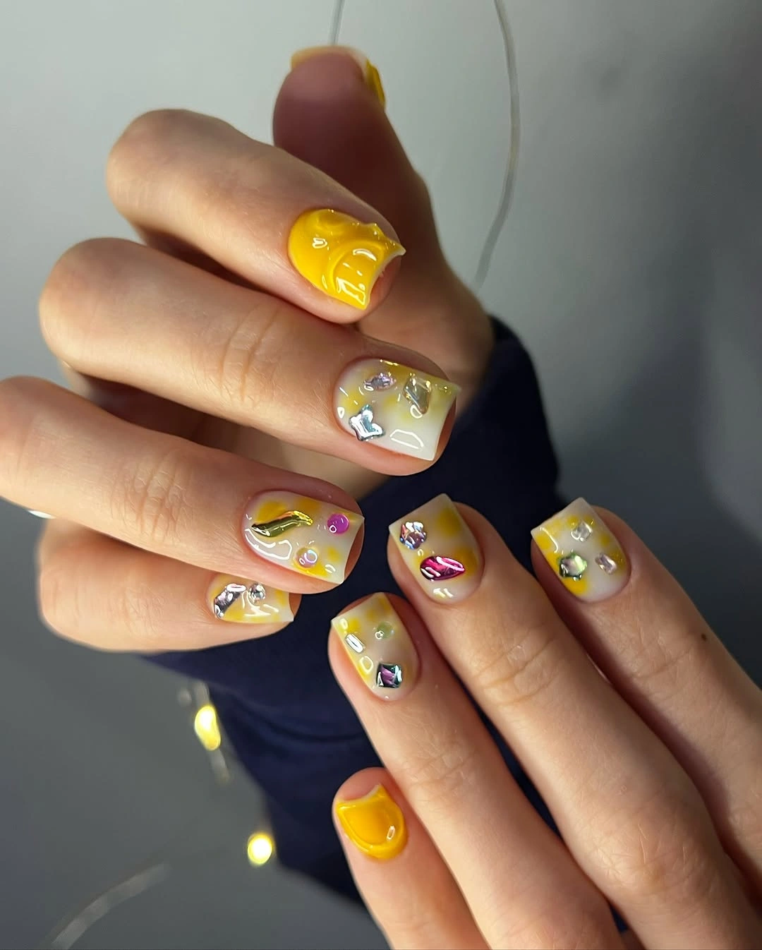short yellow square nails with reflective accent details