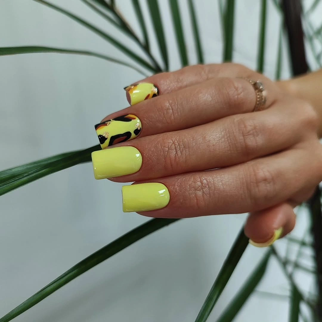 lemon yellow square nails with leopard accents