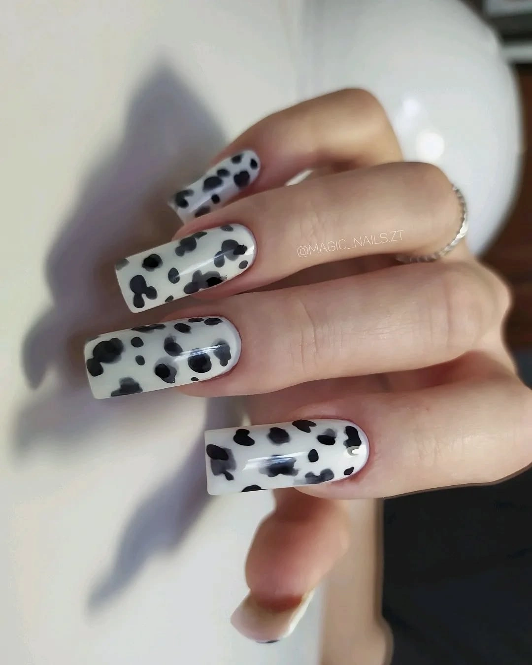 long square white nails with black cow spots