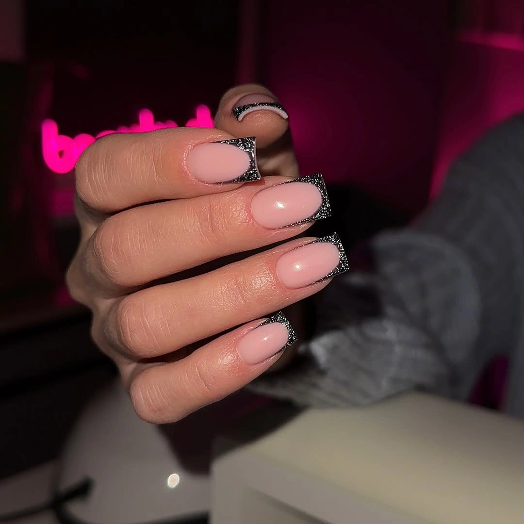 nude square nails with black glitter French tips