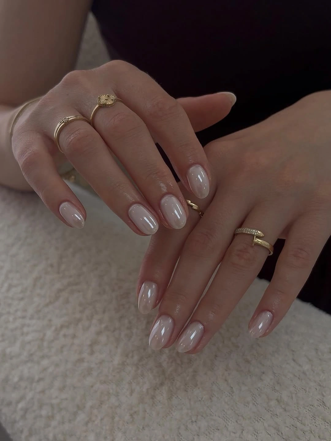 Medium almond nails with sheer pink bases and pale tips