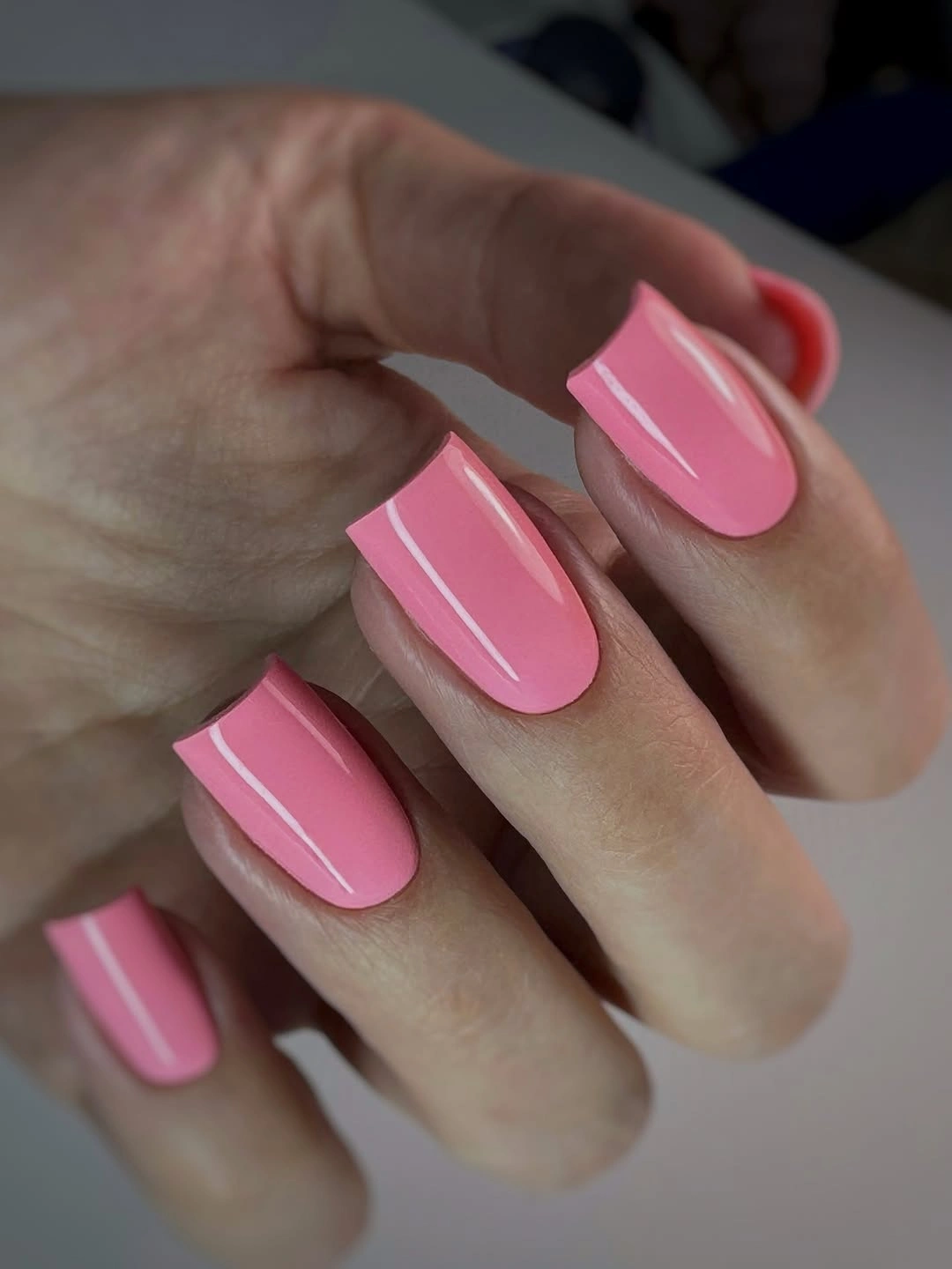 Medium square nails in a solid glossy bright pink