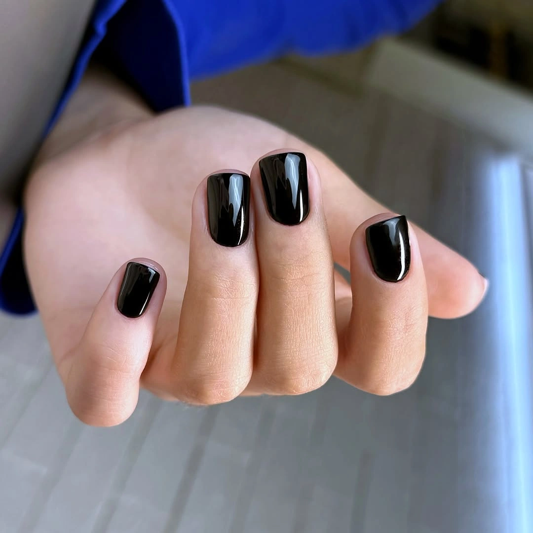 Medium square nails in dense glossy black polish