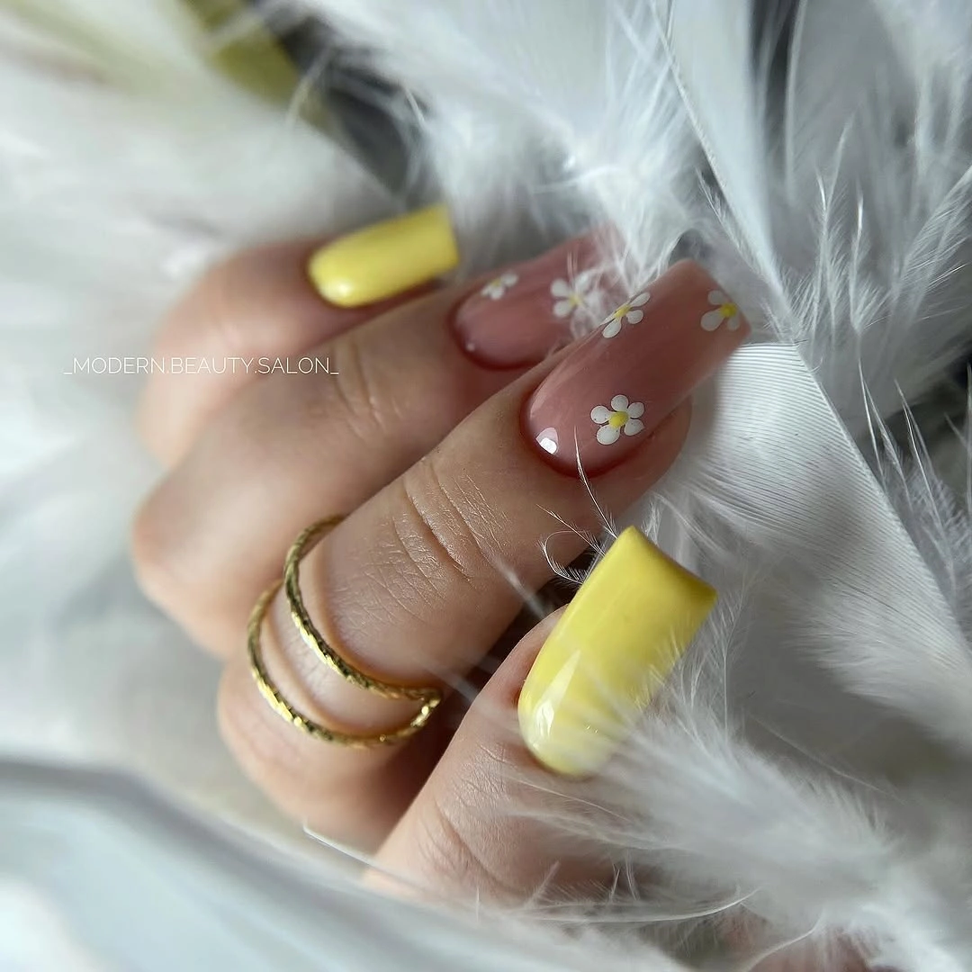 Medium square nails with yellow tips and tiny floral accents