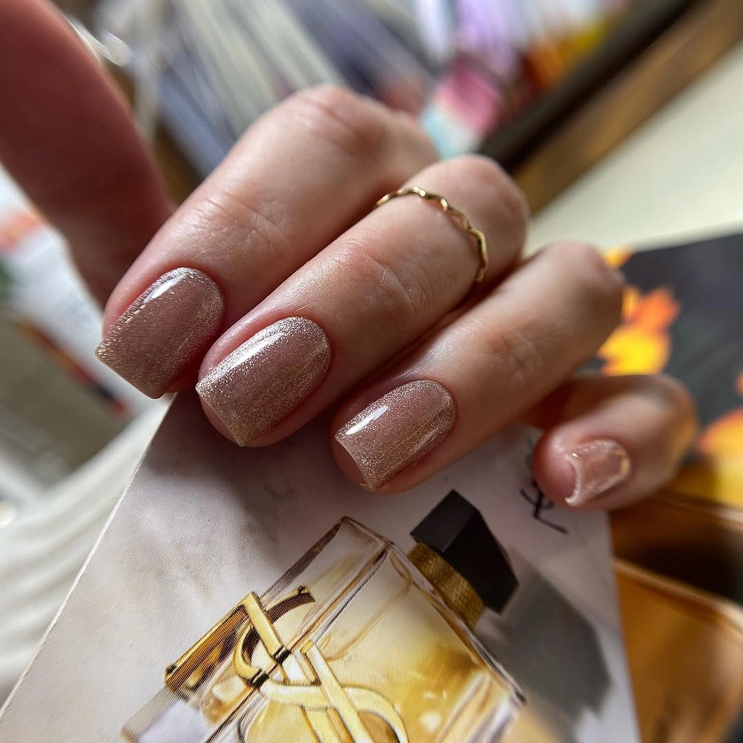 Short square nails with sheer pink base and fine pale outlines