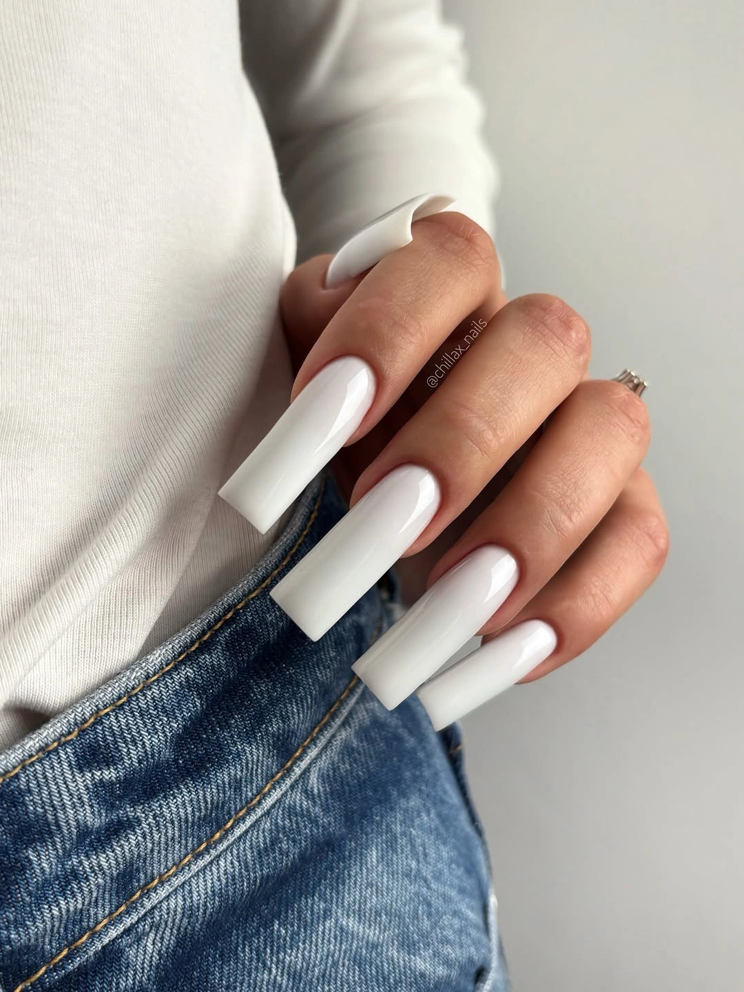 Long square nails in opaque glossy white polish