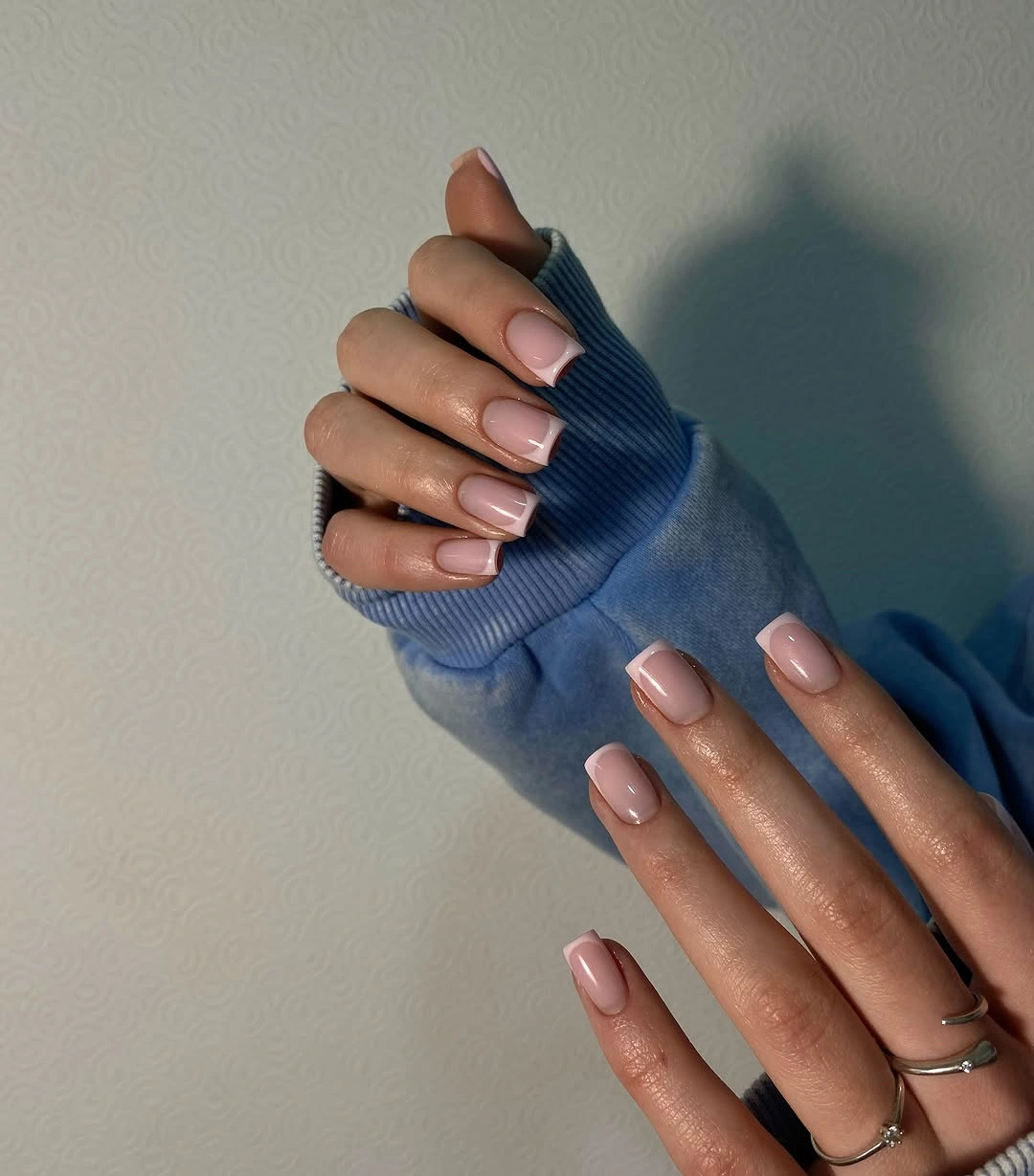 Medium square nails with nude base and blue gray French tips