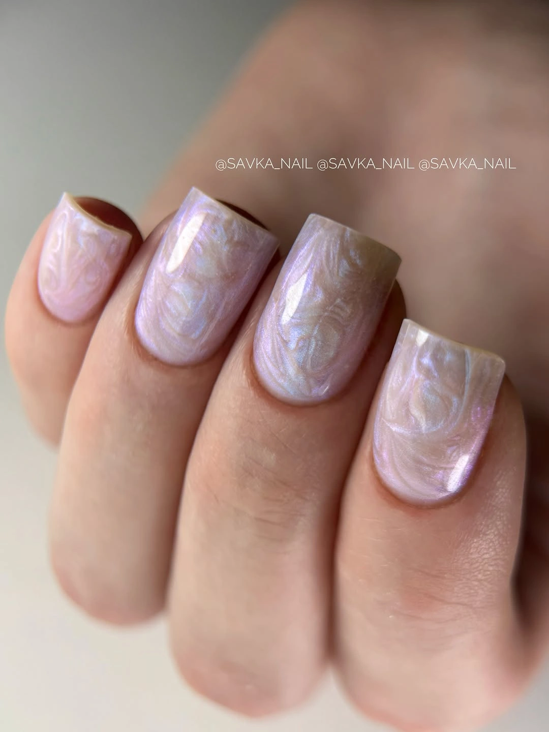 Medium square nails with pale lilac pearly swirl details