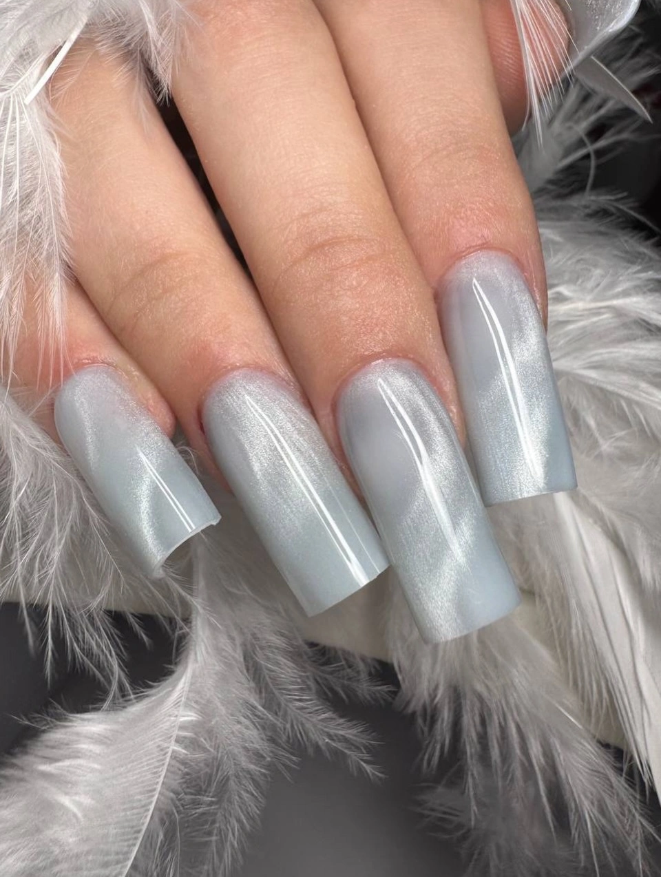Long square nails with a milky gray white translucent sheen