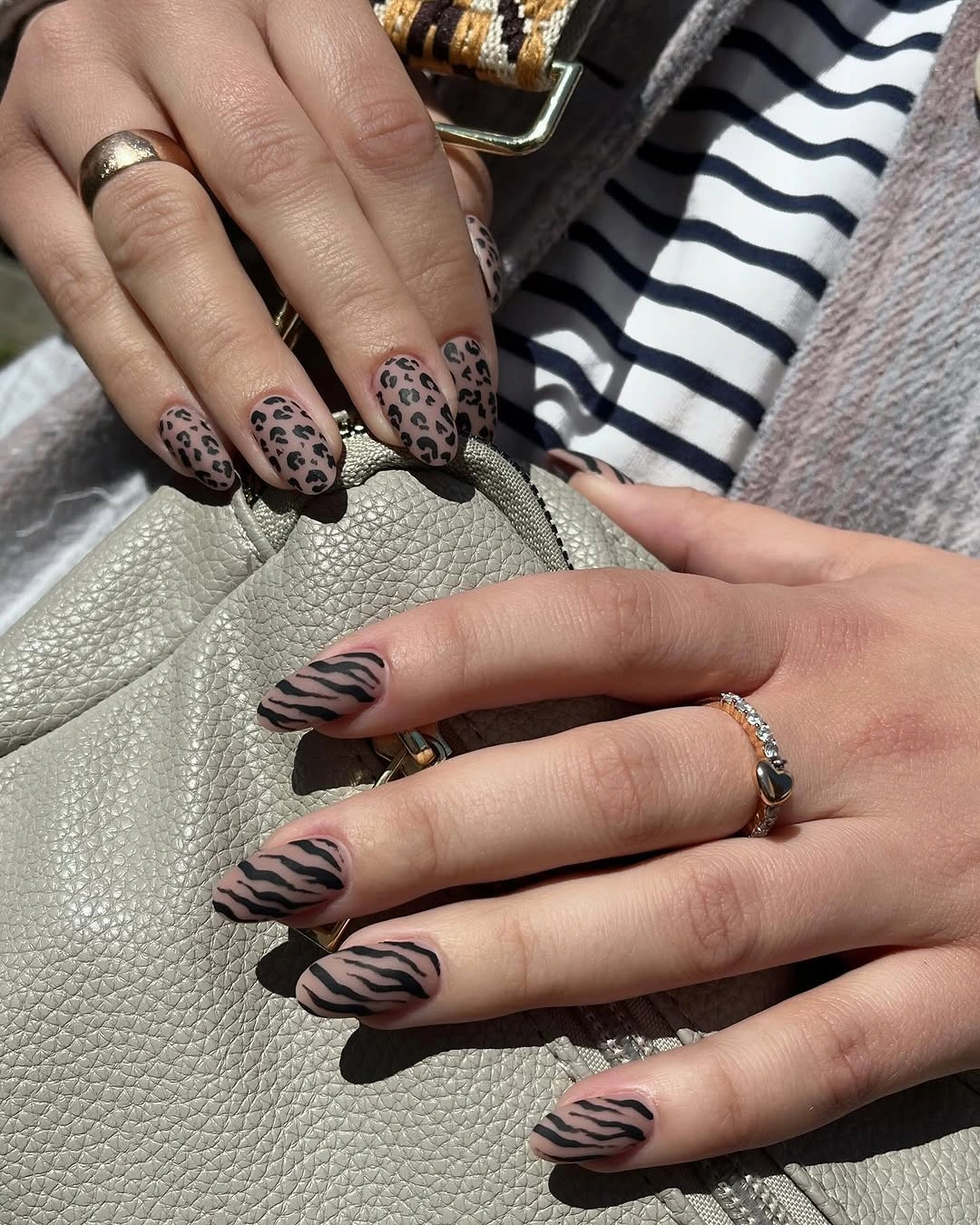 Almond nails with split animal print designs