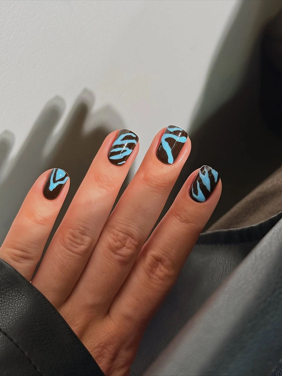 Chocolate nails with sky blue squiggle lines