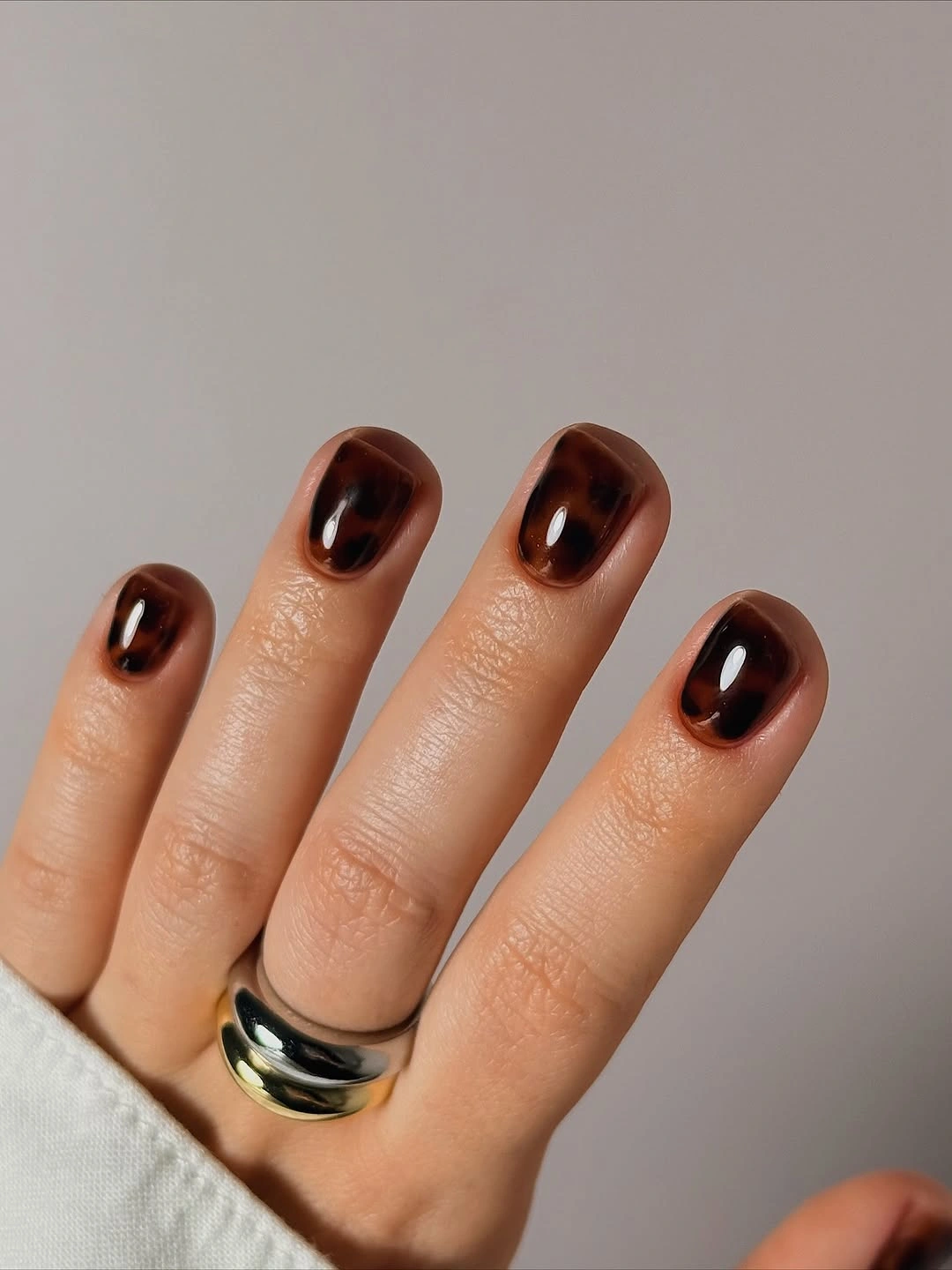 Short glossy amber tortoiseshell nails