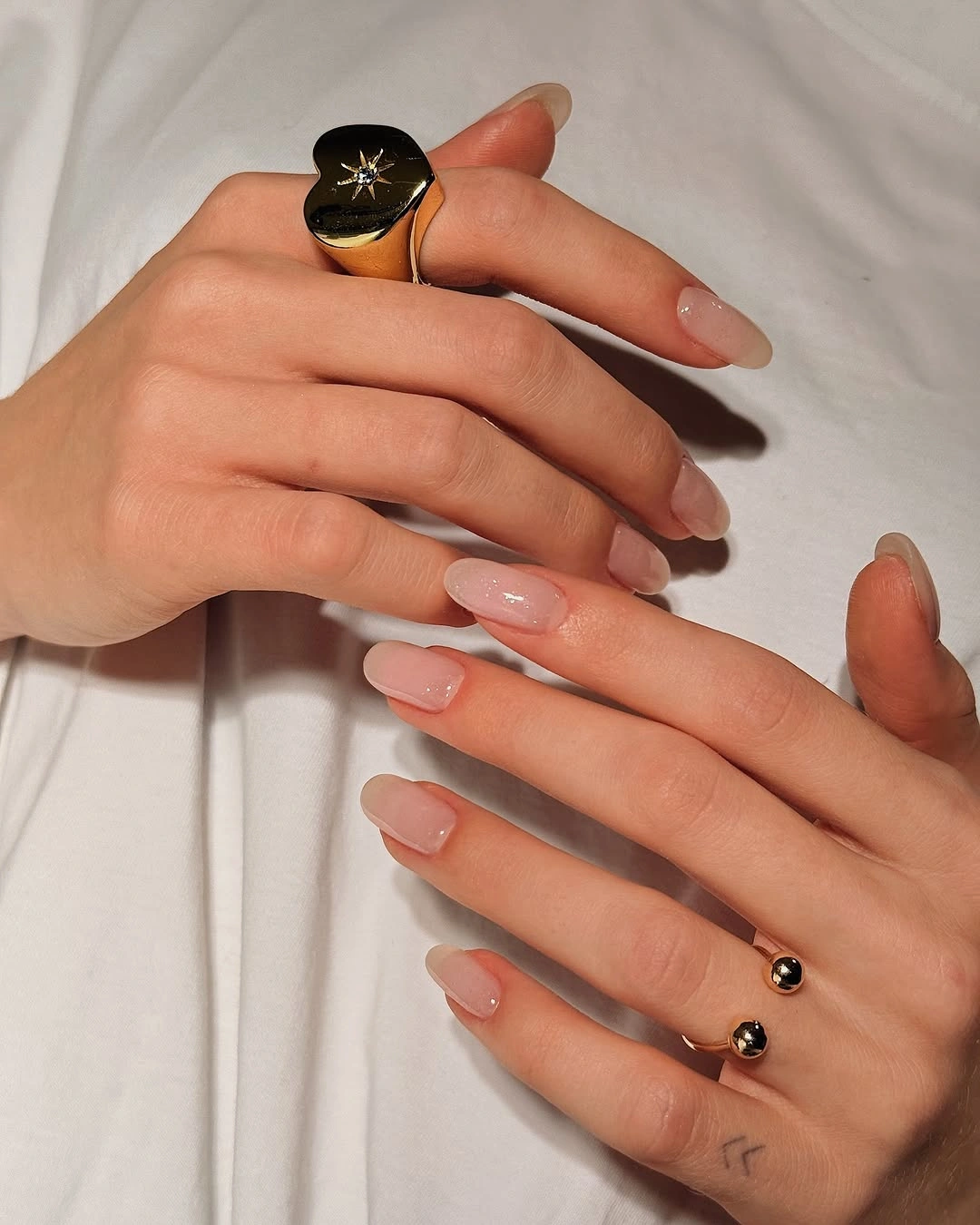 Sheer nude pink almond nails