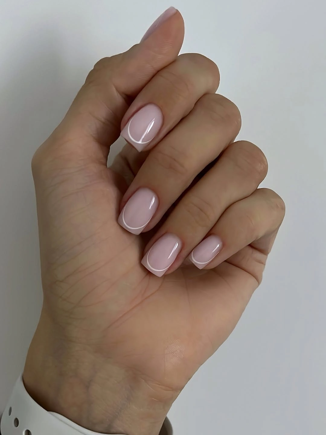Nude square nails with white outline tips