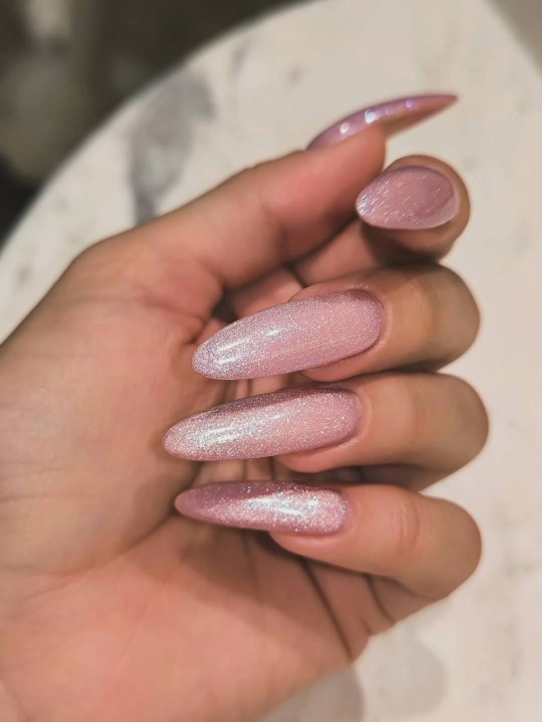 Soft pink shimmer long almond nails