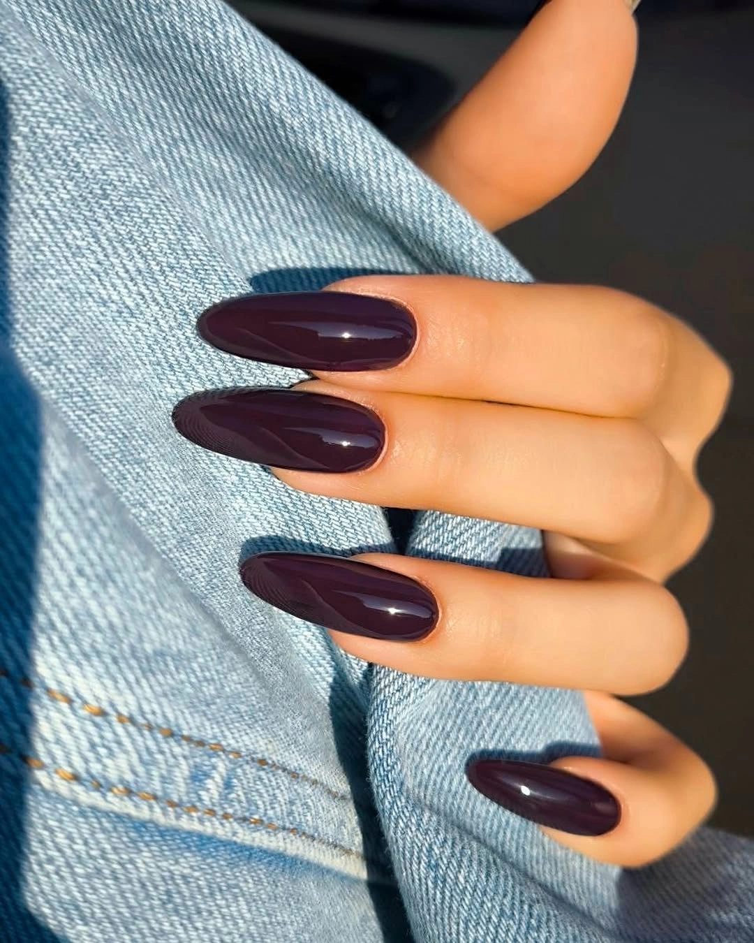Glossy plum burgundy almond nails