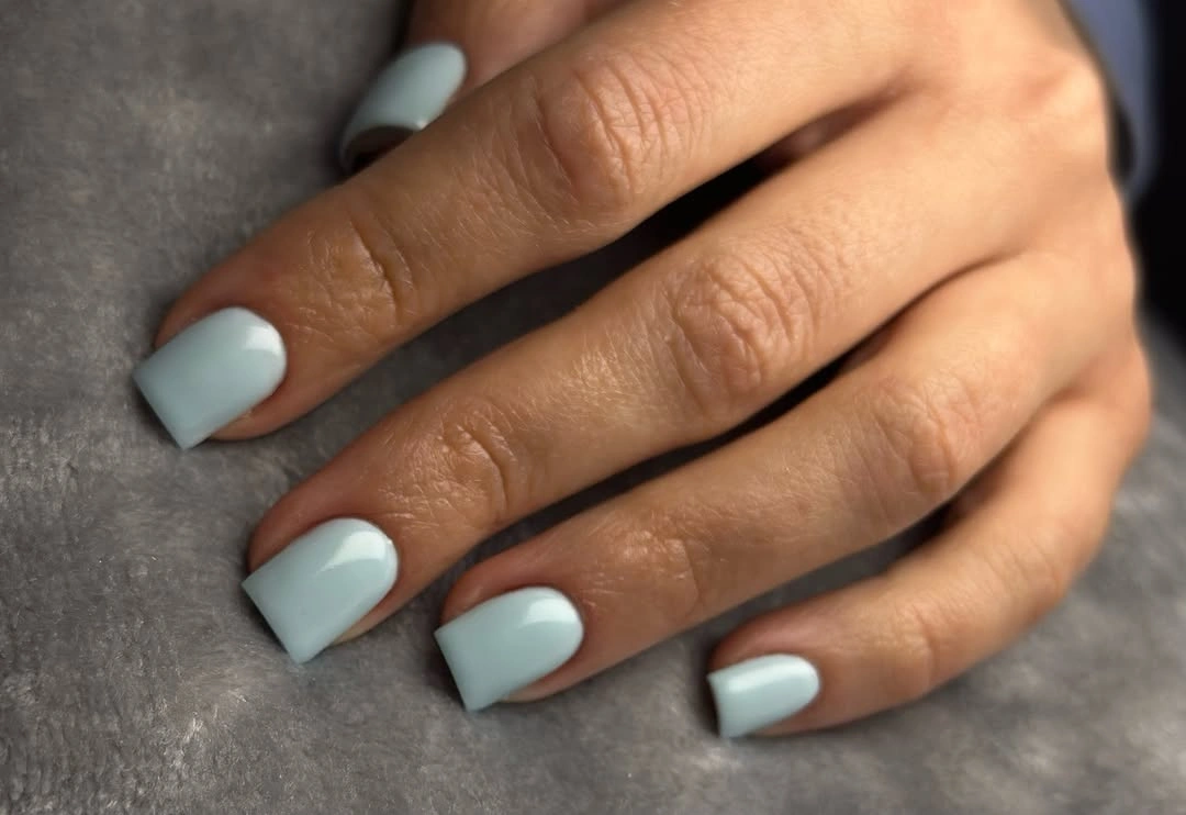 Short square nails painted glossy icy powder blue