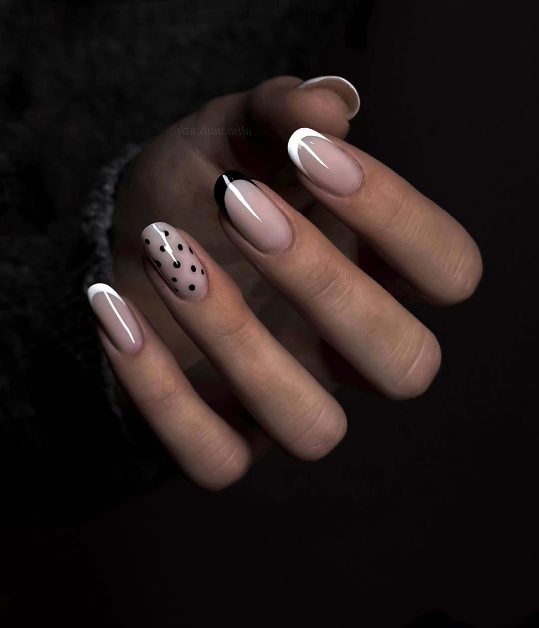 Medium blush almond nails with one dotted accent finger