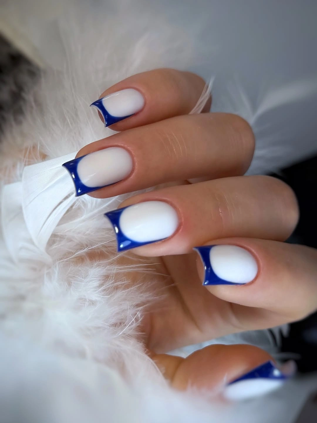 Milky square nails with vivid cobalt outlined tips