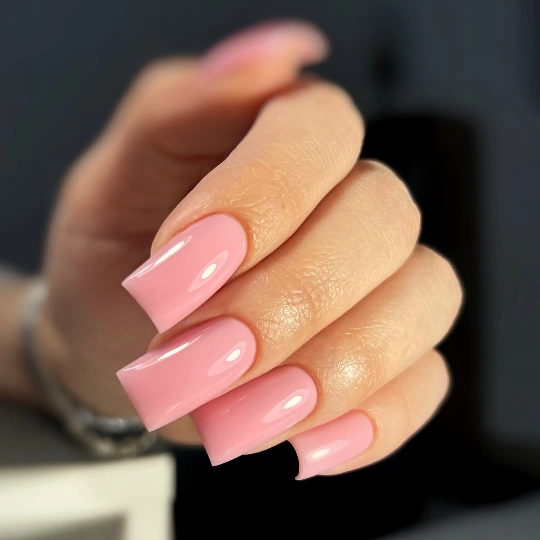 Long square nails in glossy bright pink coral polish