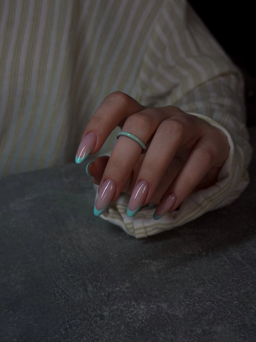 Sheer pink tapered nails with aqua and coral colored tips