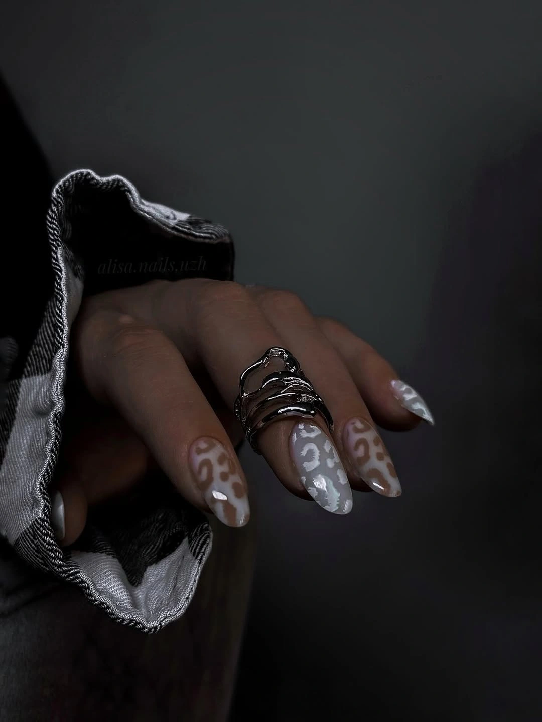 Long almond nails with taupe smoky swirl details