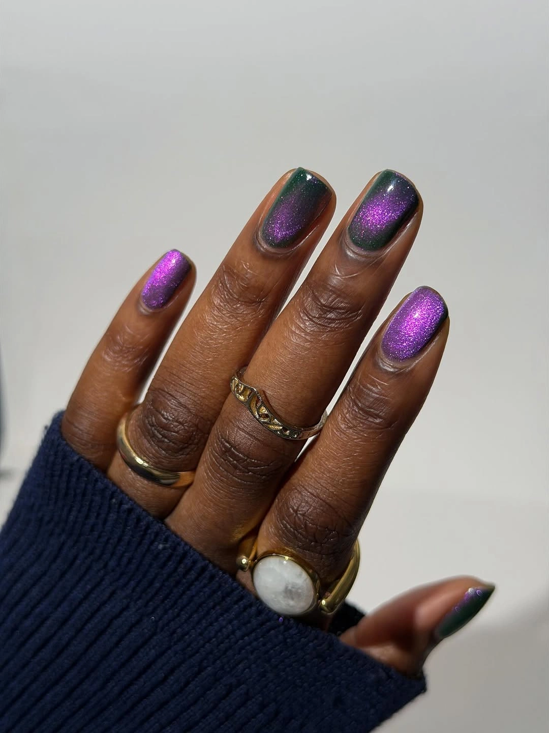 Short purple reflective nails with cool color-shifting highlights
