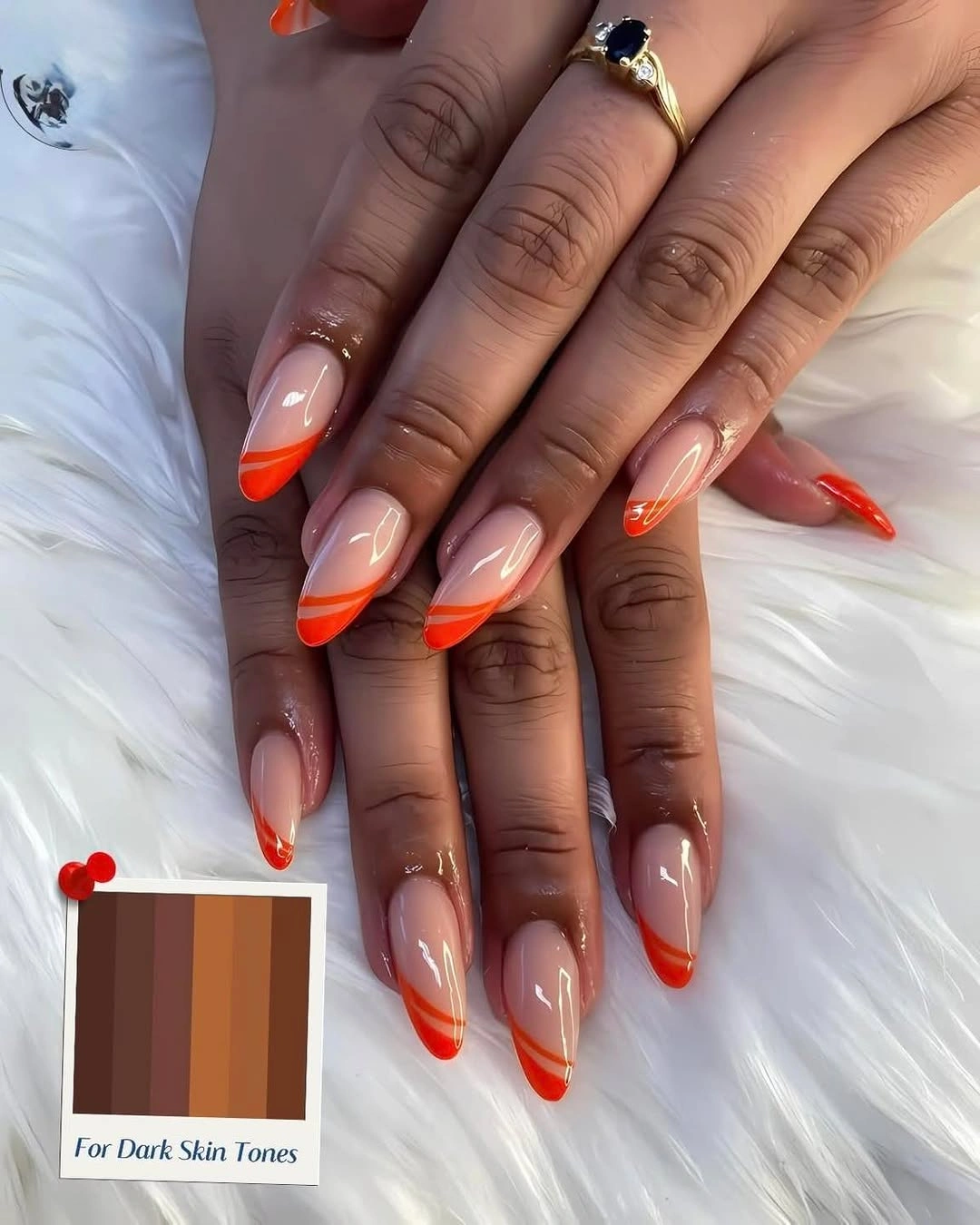 Nude almond nails with bright orange French tips