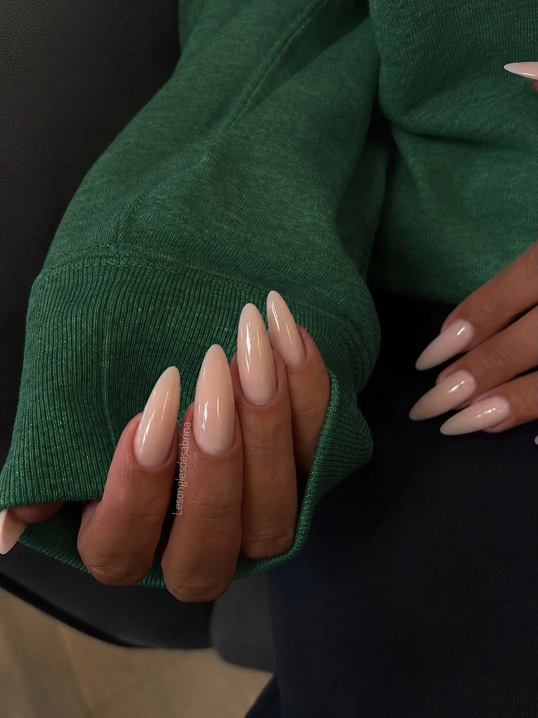 Long almond nails in glossy pale peach beige nude