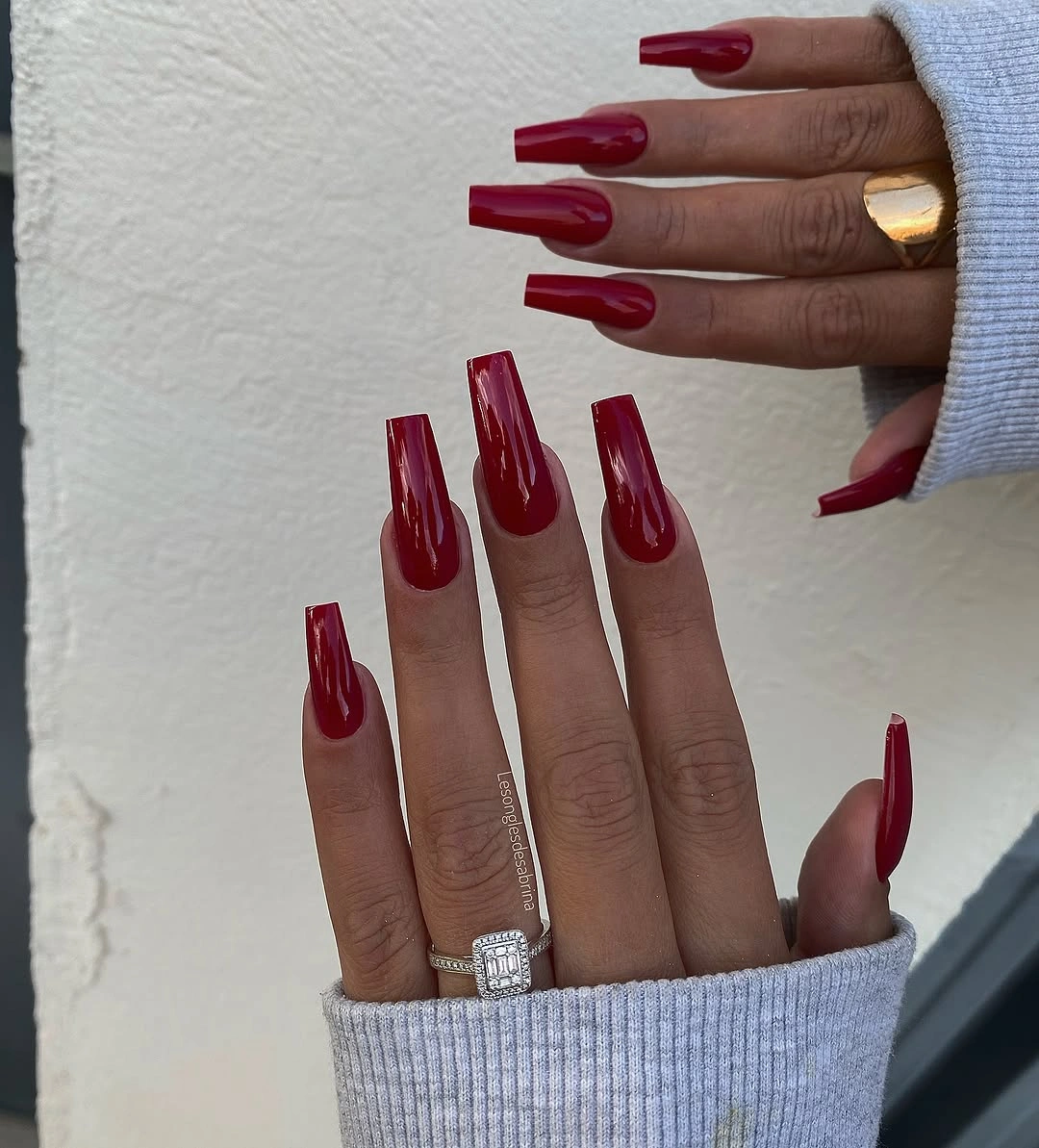 Long deep burgundy coffin nails with selective gold accents