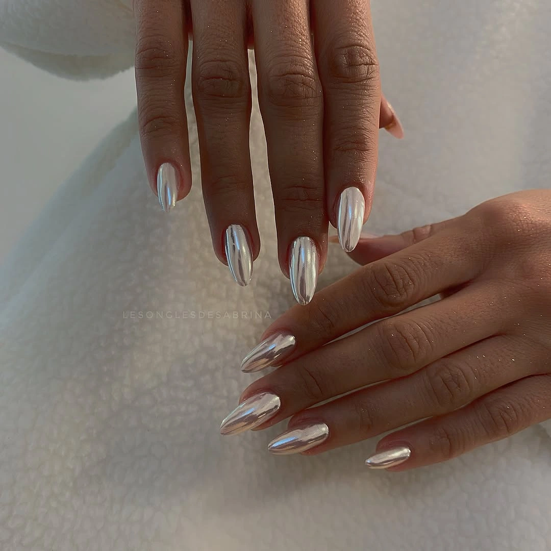 Long pointed milky nails with cool blue silver edge accents