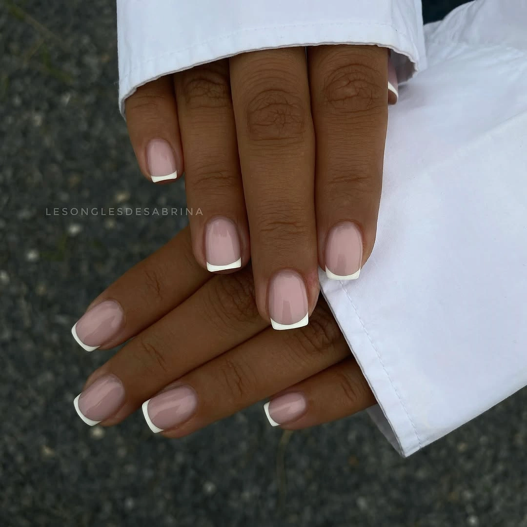 Long coffin nails with sheer blush and white outlined accents