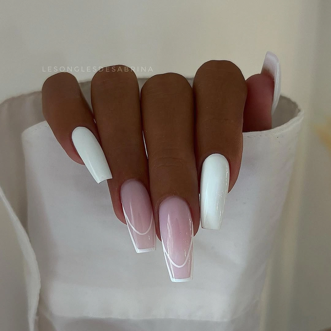Long coffin nails with translucent pink white and outlined tips