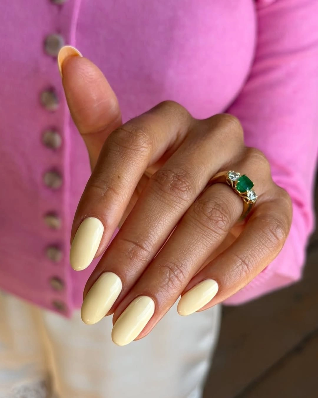 Long almond nails in pale creamy butter yellow
