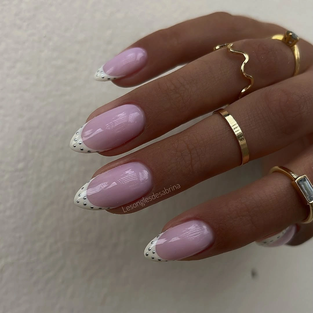 Long lavender almond nails with dotted white tip accents