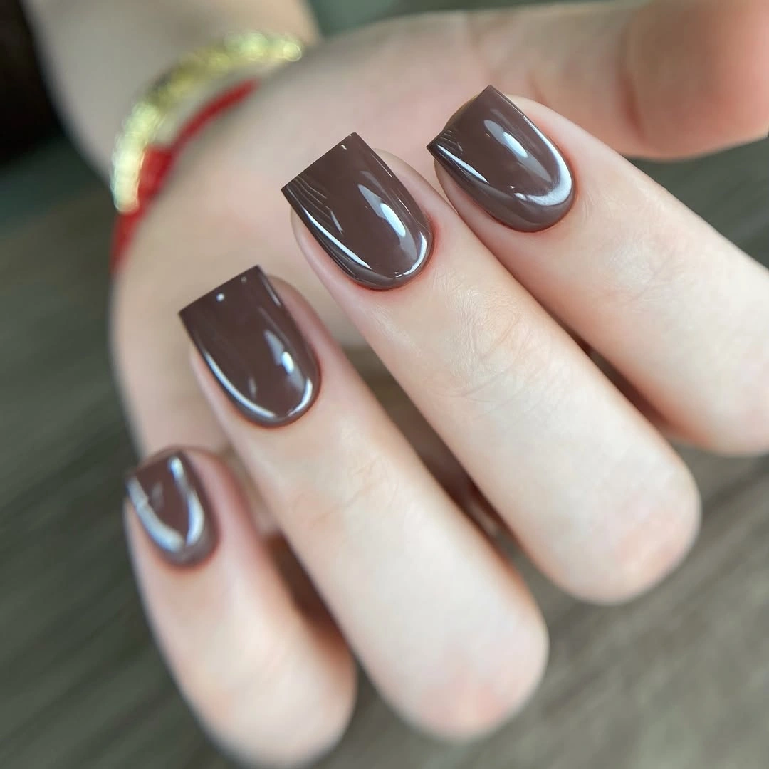 Short rounded square nails in glossy smoky taupe brown