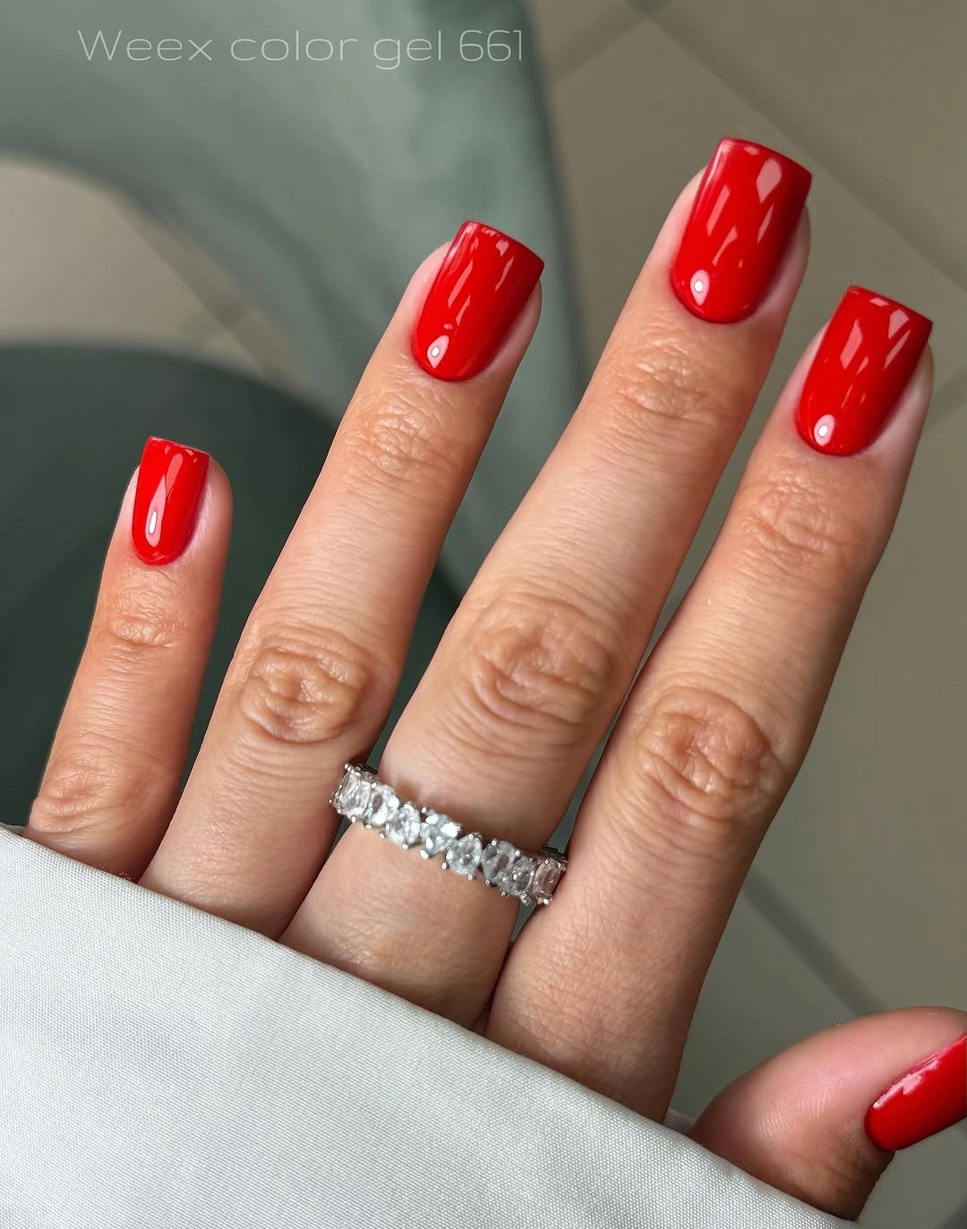 Vivid red long square nails with a glossy finish