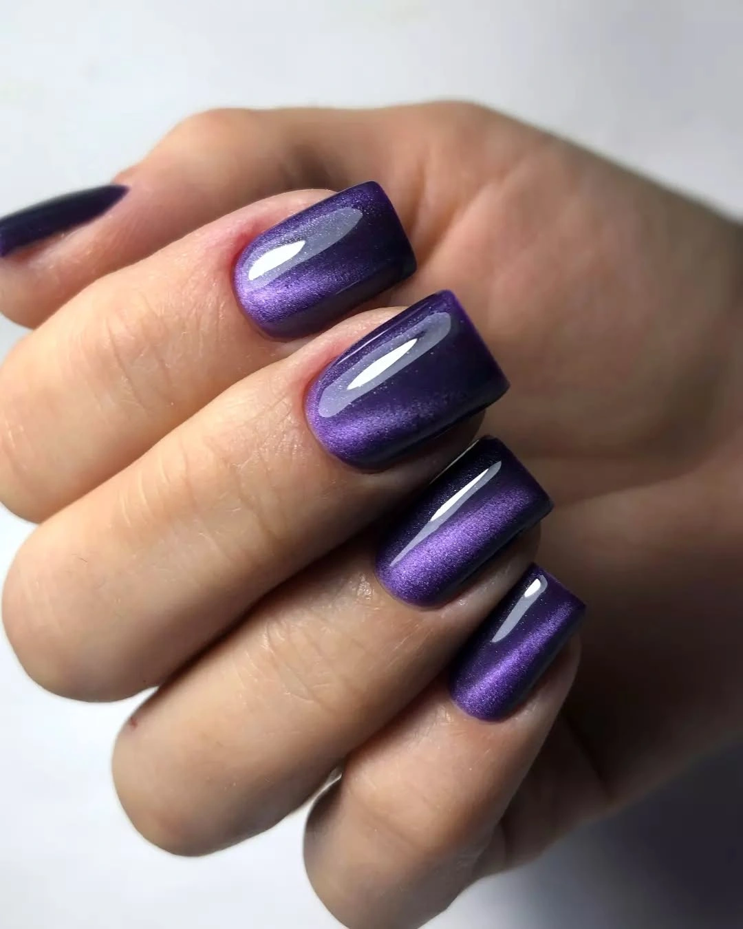 Reflective indigo square nails with vivid purple depth