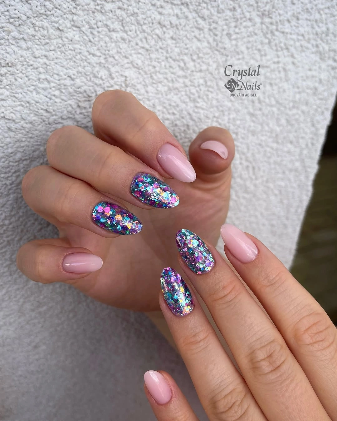 Medium square pink nails with concentrated iridescent sparkle