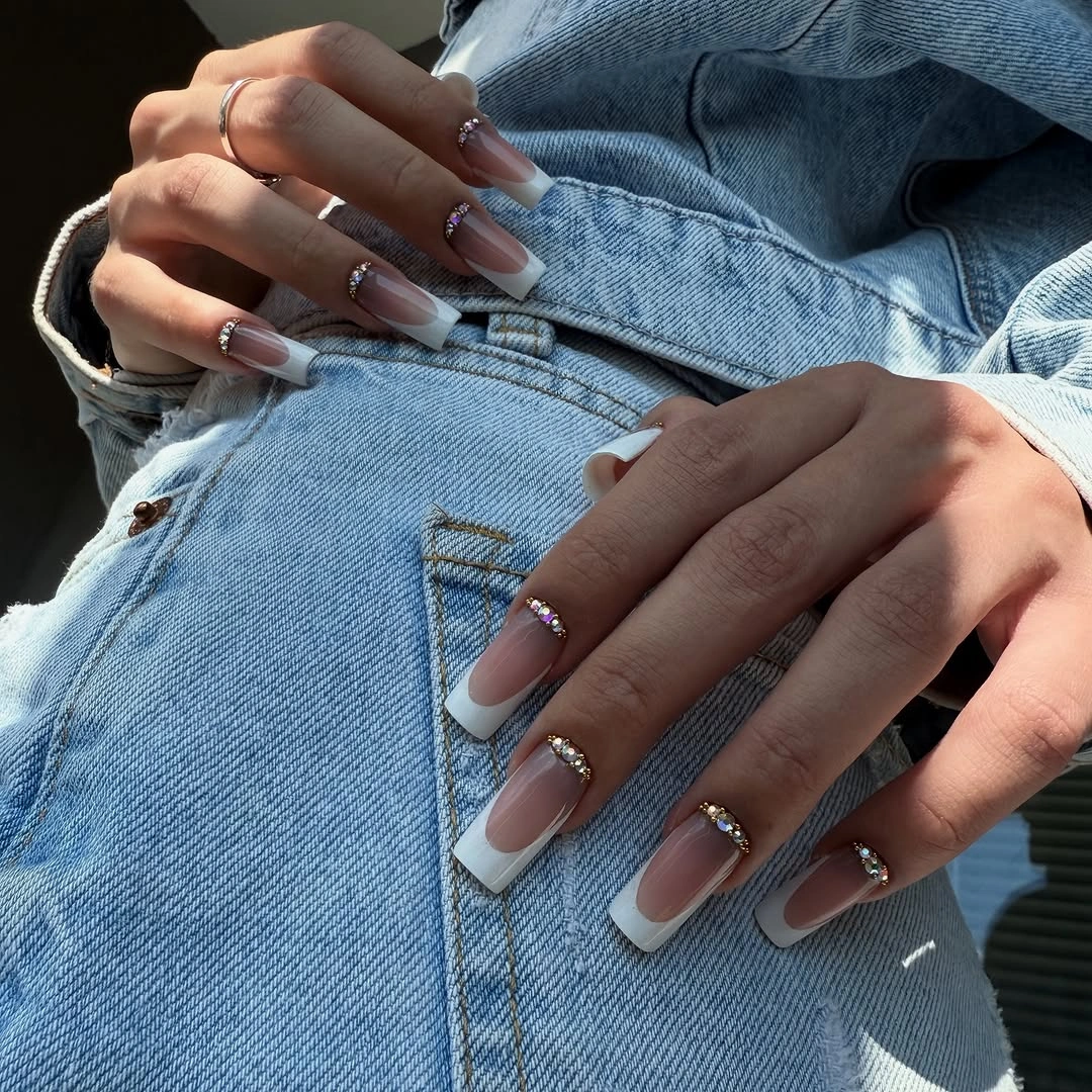 Long almond nails with pale tips and fine cool line details