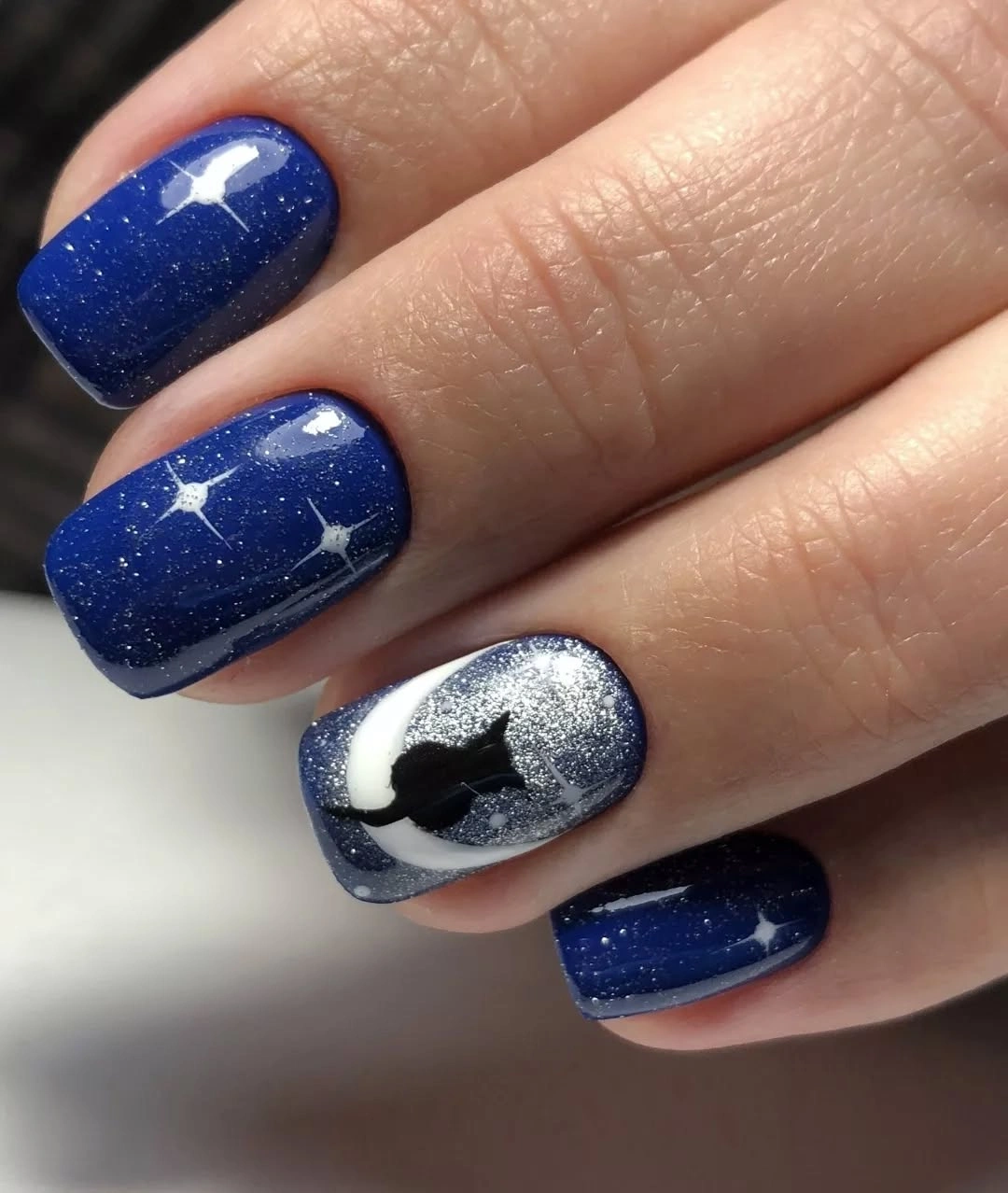 Navy shimmer square nails with one silver accent