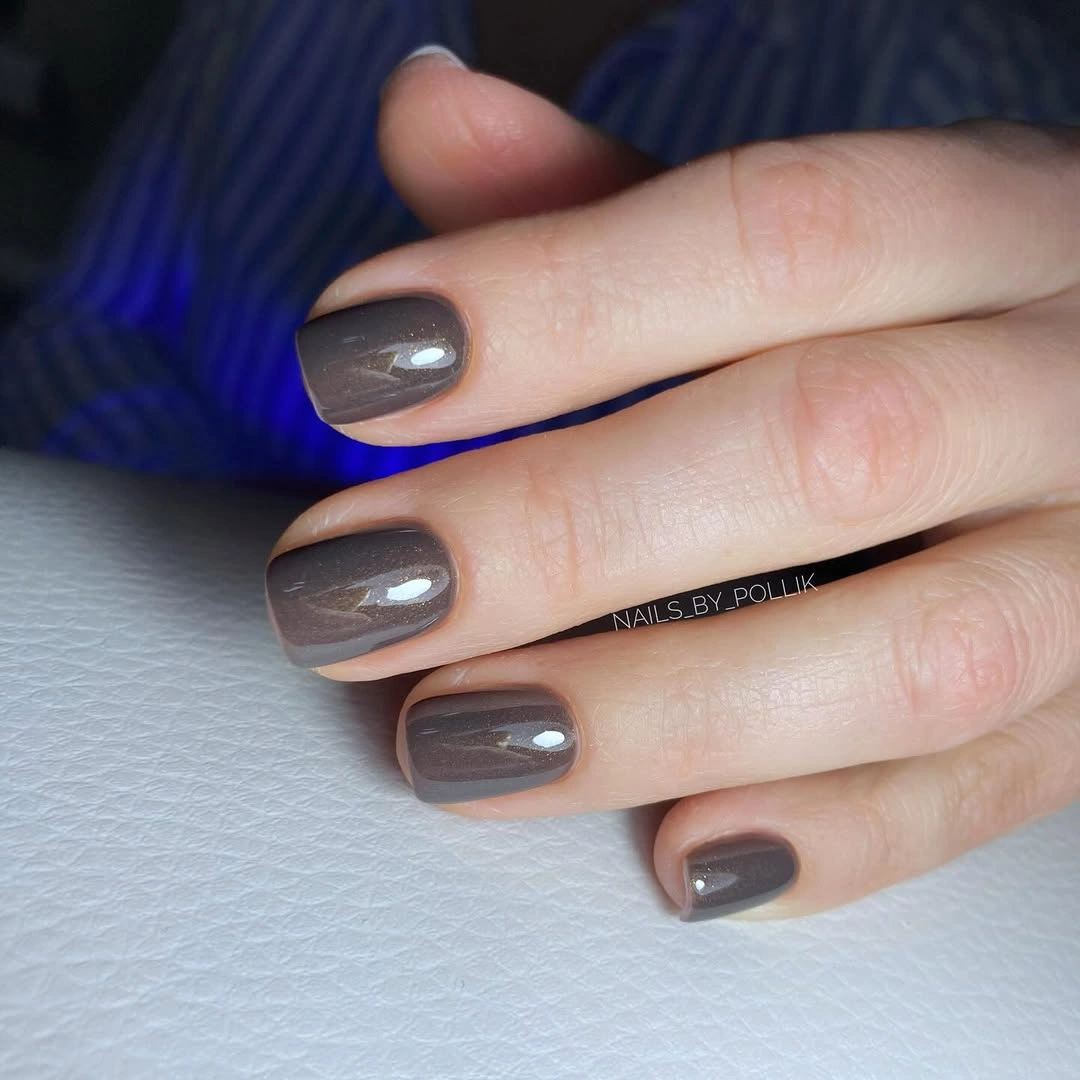 Short glossy square nails in a smoky taupe brown shade