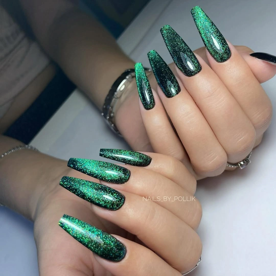 Long almond emerald green nails with a fine shimmering surface