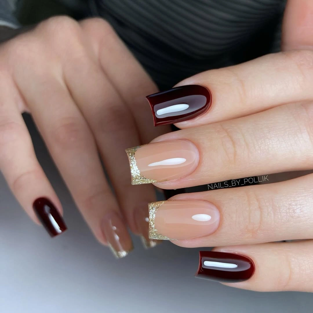 Medium square burgundy nails with pale curved graphic openings