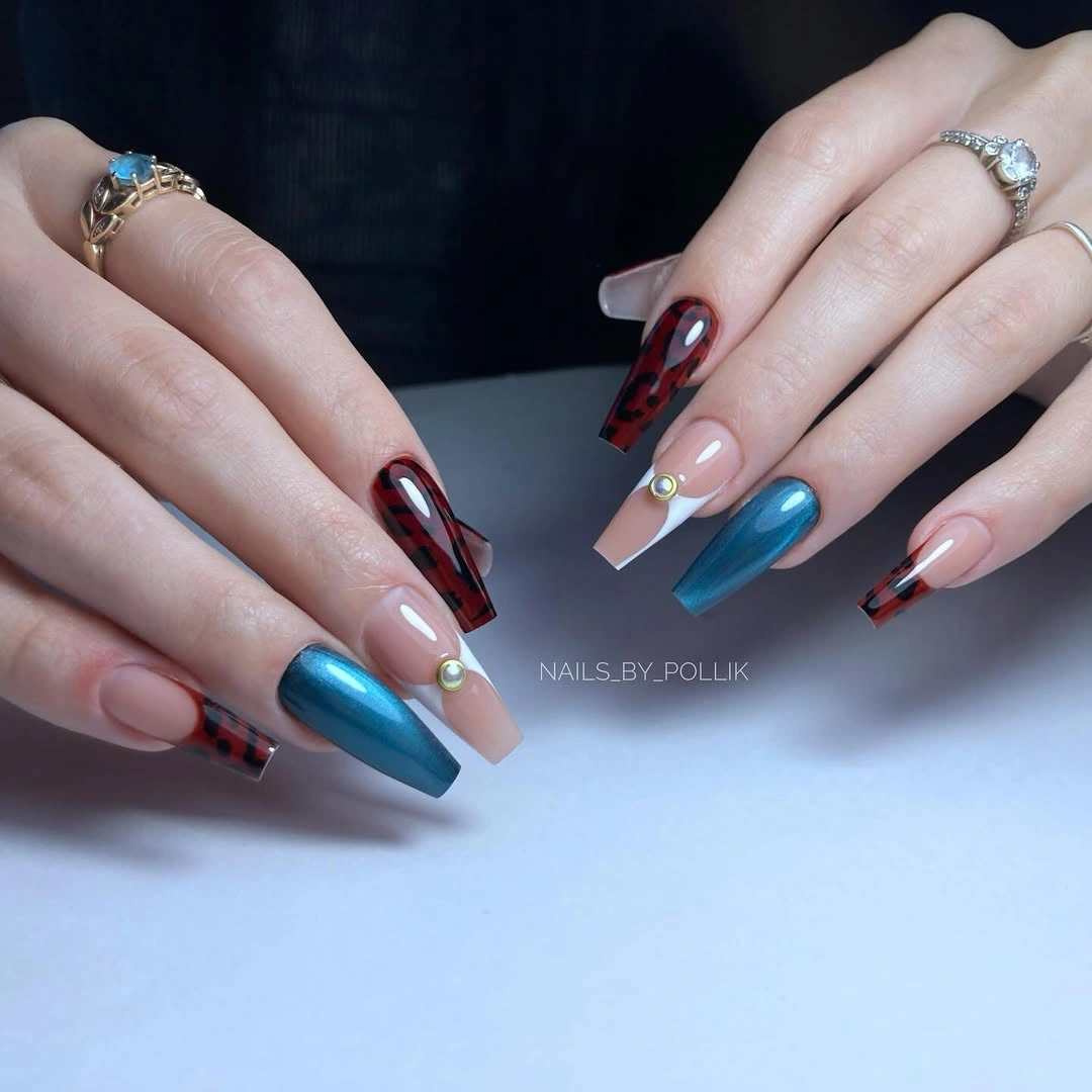 Long almond nails mixing deep plum blue and silver reflective accents