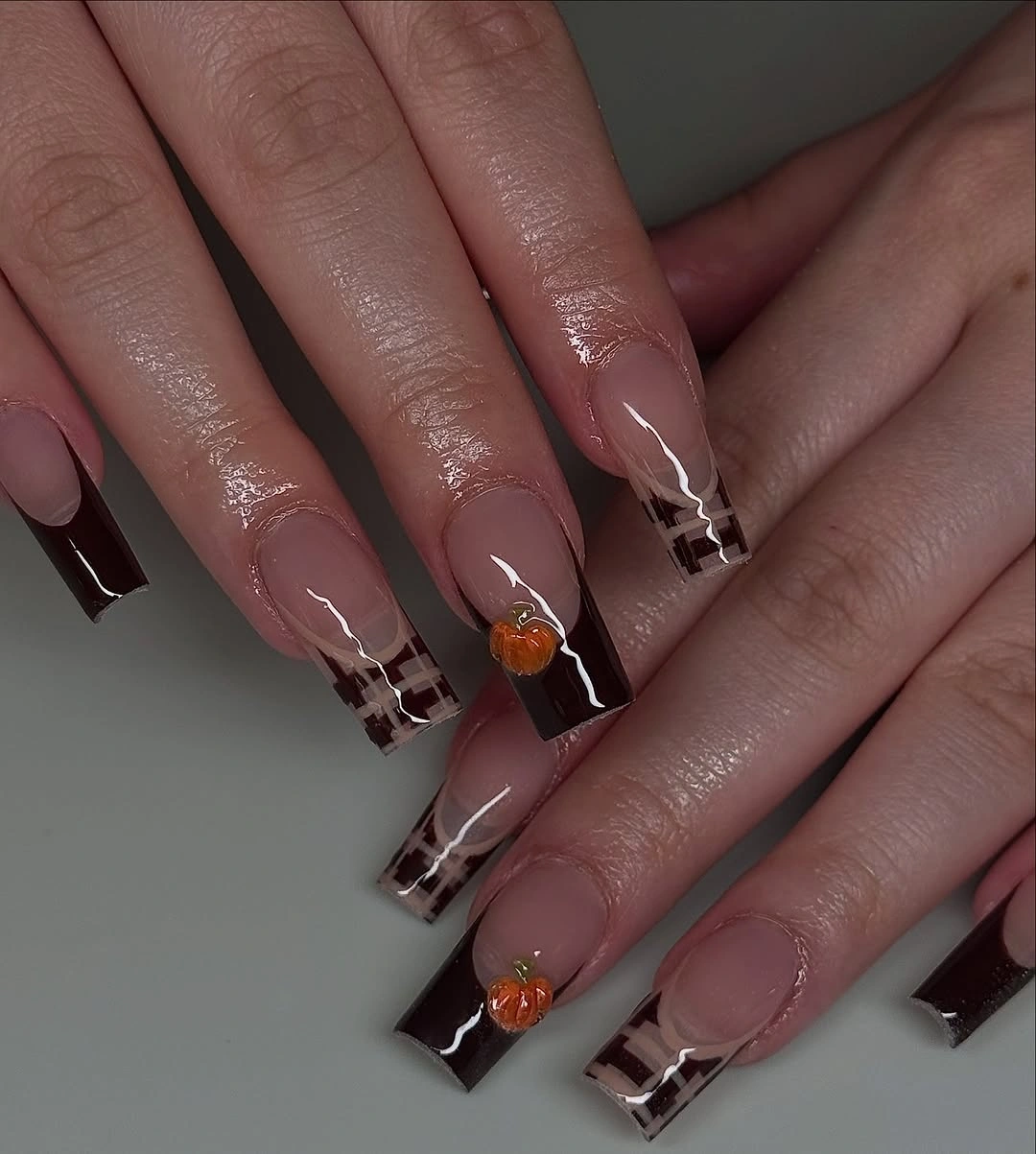 Long square mauve nails with burgundy French edges and tiny accents